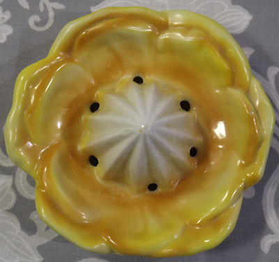 Yellow and white flower with black handle reamer