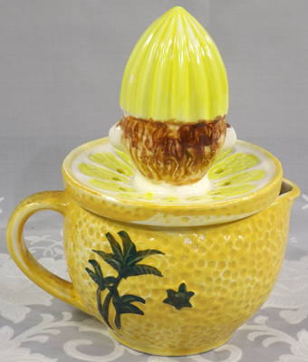 Back of Yellow Florida juicer with clown reamer