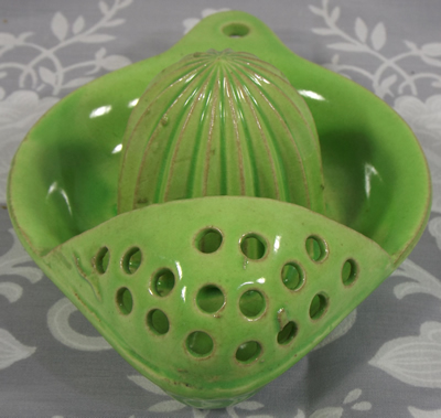 Strainer on lime green hanging strainer juicer