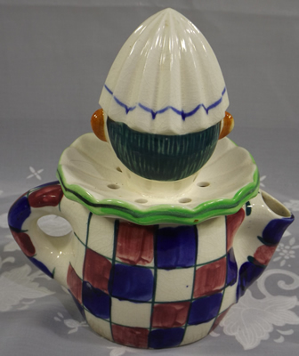 Back of purple & blue checkered clown juicer