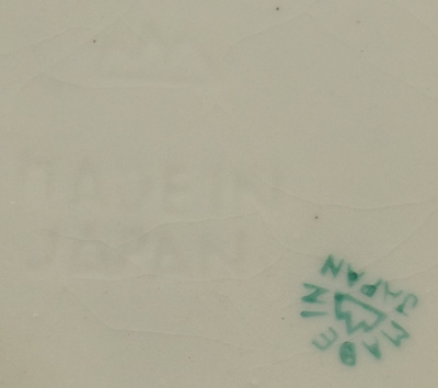 Green on white clown with orange and green hat juicer base mark
