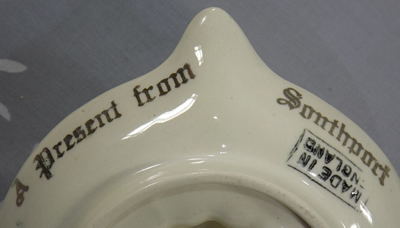 Blue and peach "A present from Southport" souvenir juicer base view