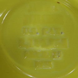 Yellow "Jiffy Juicer" juicer base mark