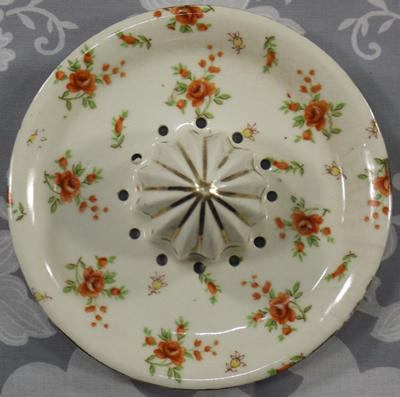Small brown flowers on white reamer