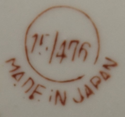 The basemark on an 'ORANGE JUICE' and chicks on cream jug juicer