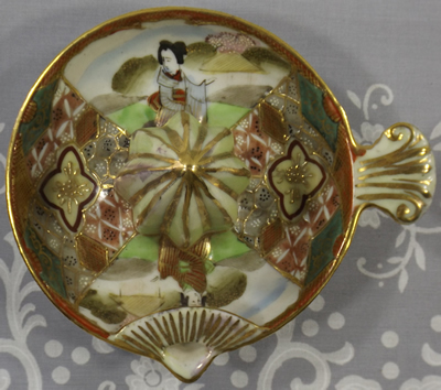 Top view of a hand painted gold possibly Noritake juicer