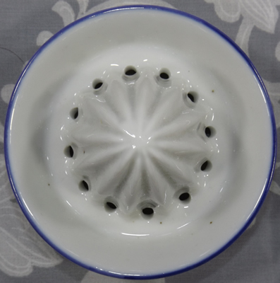 White 'teapot' with blue trim reamer