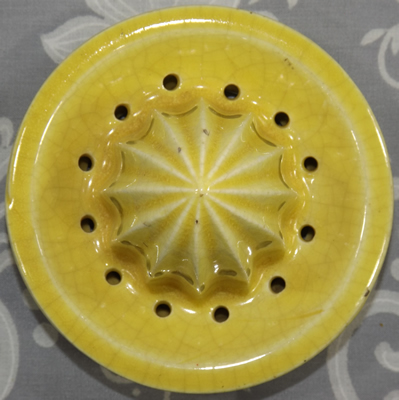 Large yellow stylised parrot reamer