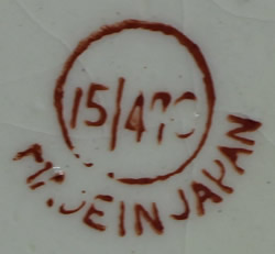 The basemark on an 'ORANGE JUICE' and chicks on a pale green jug juicer