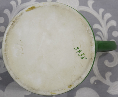 Base of a Gustav M. Thurnauer and Brother juicer with green trim reamer