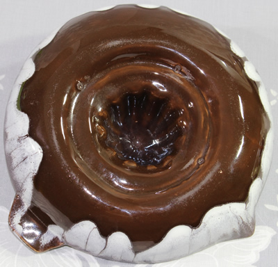 Bottom view of White and brown Spratty juicer