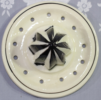 Reamer for Flowers and black trim on white 2 piece juicer