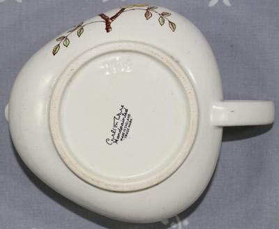 The base of a triangular Carlton Ware Mimosa pattern juicer
