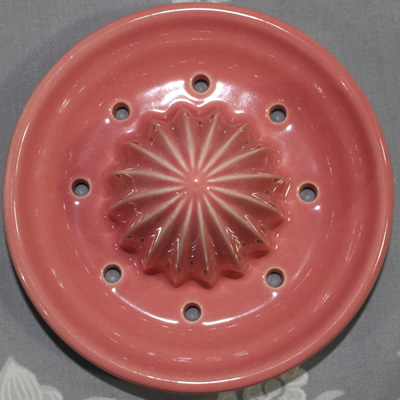 Reamer for yellow and pink ceramic jug juicer