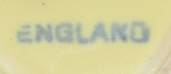 Base mark on pale yellow English strainer juicer 