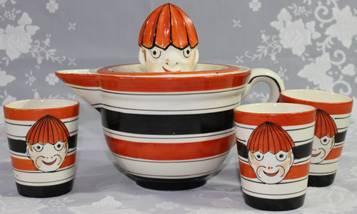 Red and black banded clown jug juicer including tumblers