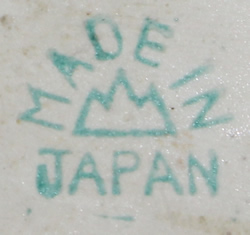 Basemark on pale blue and white clown with shade of tan juicer