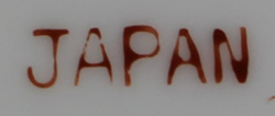 The basemark on a Mauve flowers on small 2 piece ceramic jug juicer