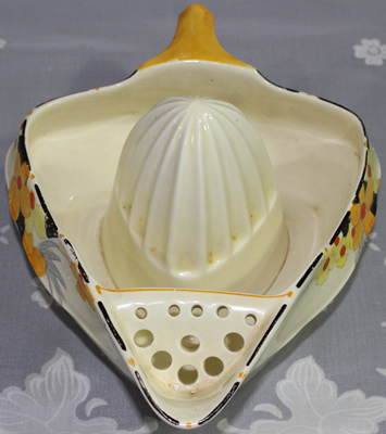 Strainer view of a Crown Ducal Ware Sunburst pattern juicer