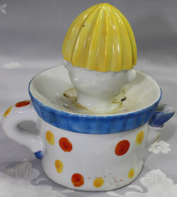 The back of a Klimax clown with green and blue pant legs juicer
