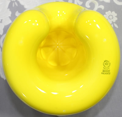 The base of a yellow Royal Copenhagen 1 piece juicer