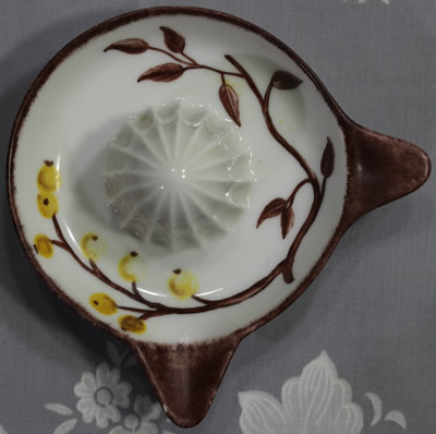 Top view of a hand painted yellow fruit juicer