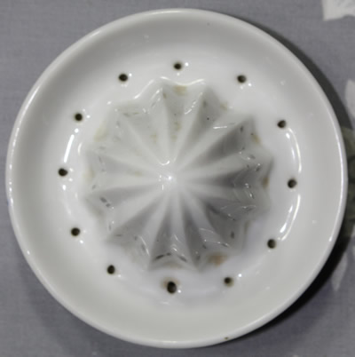 The reamer for a blue pattern on a white ceramic juicer 