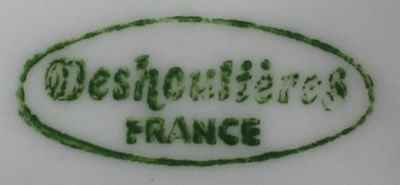 The basemark on a Deshoulières white ceramic saucer shape juicer 