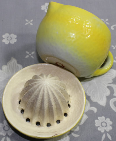 The partial Maruyama Toki basemark on a yellow and white 'peel' 2 piece juicer
