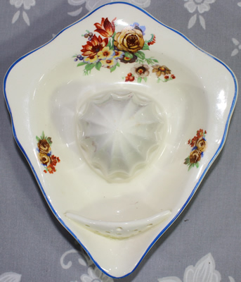 Top view of white with multicoloured flowers Crown Ducal ceramic juicer