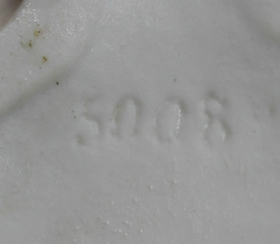 The impressed 5008 on a red head orange beak chicken lustre juicer