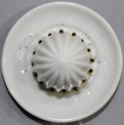 The reamer for a small orange and white peel texture ceramic juicer