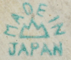 The basemark on a 4¼" pink, orange and white clown juicer