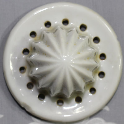 The reamer for a stylised flower on 2 piece white ceramic juicer
