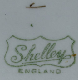 The basemark on a Shelley orange, grey and brown drip glaze juicer