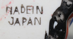 The basemark on a black, red and blue monkey Japan juicer