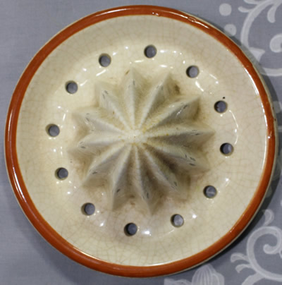 The reamer for a lemons on a large biscuit barrel with cane handle juicer
