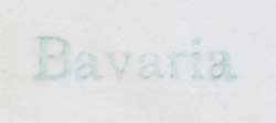 Alternate basemark on a red with green leaves ceramic juicer 