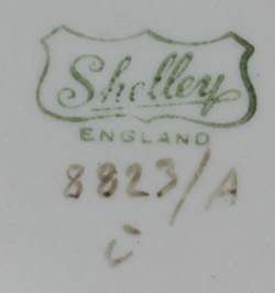 The basemark on an orange, green and grey Shelley drip glaze juicer jug