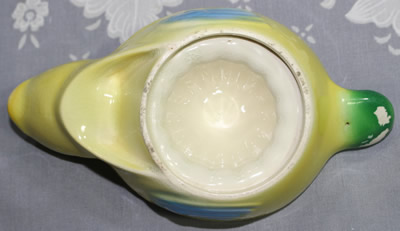 The base of a Beswick yellow, blue and green on white duck 1 piece juicer