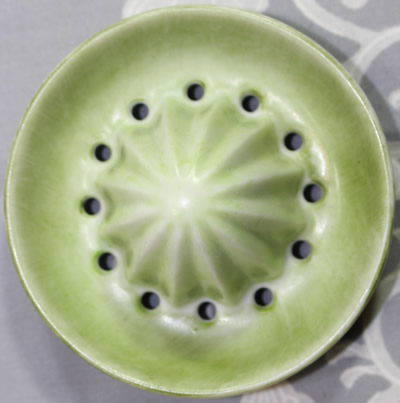 Reamer for a large red with green leaves ceramic juicer