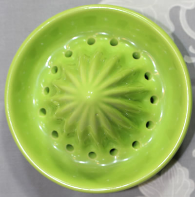 Reamer for a large red with green leaves ceramic juicer
