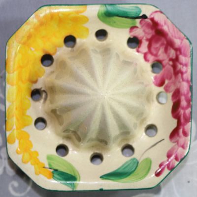 Reamer for a Sylvan Ware juicer with mauve and yellow flowers juicer