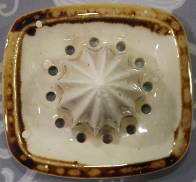 Grapes on brown lemonade set ceramic reamer