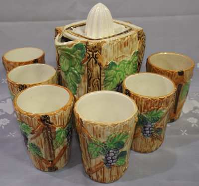 Grapes on brown lemonade set ceramic juicer and tumblers