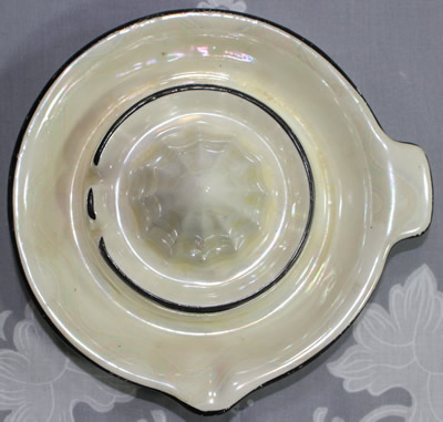 Top view of a black trim on patterned white Czecho-Slovakia juicer