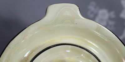 Swirls on a black trim on patterned white Czecho-Slovakia juicer
