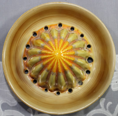 The reamer for a Shelley orange shades and beige drip glaze juicer