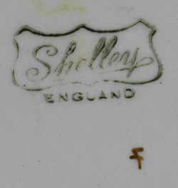The basemark on a Shelley orange shades and beige drip glaze juicer 