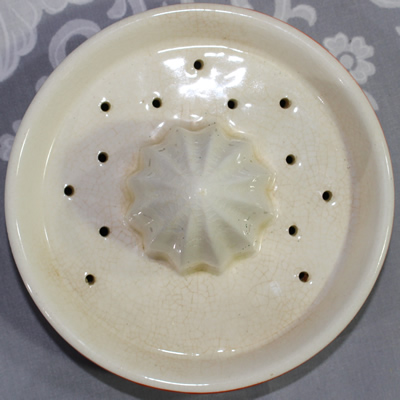Reamer for a brown, orange & white ceramic juicer